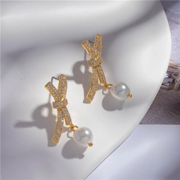 Pearl Bow Earrings | 18K Gold Plated Studs | Dainty Minimalist Jewelry - Picture 5 of 6